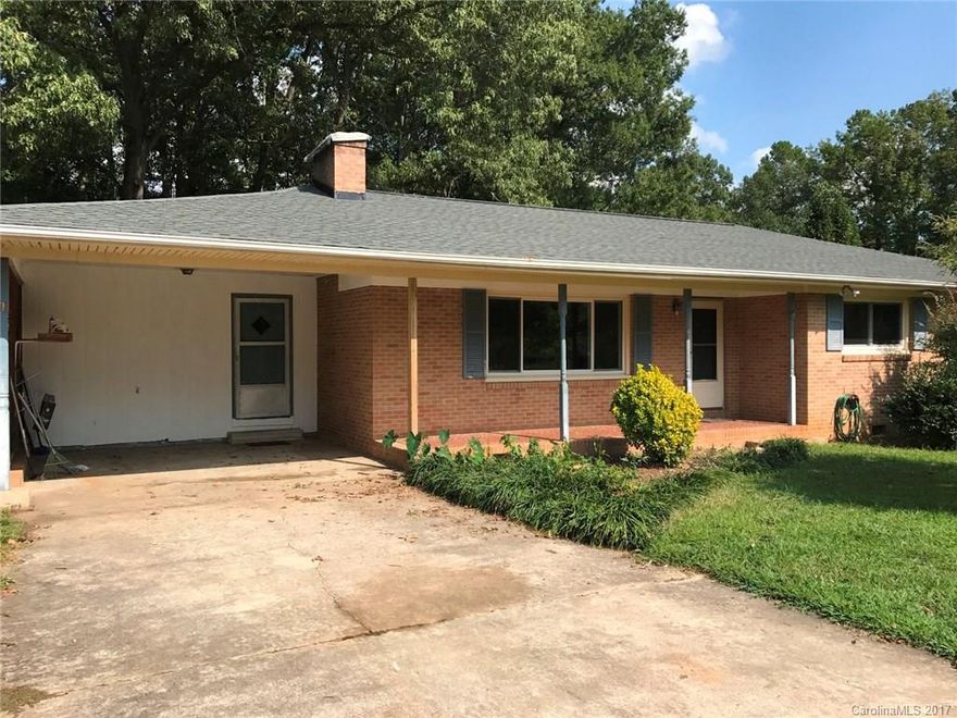 Brick ranch with all city conveniences. Wood flooring in living room, hallway and all bedrooms, portion of carport enclosed for home office/storage, insulated windows, deck, chipped tile front porch.