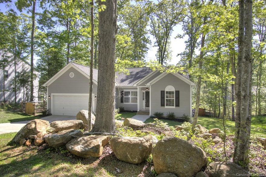 Stunning like new ranch home w/mature landscape & no HOA! 9 ft ceilings, updated kitchen w/ 42" cabinetry & granite counters. 3 bedrooms w/ master suite on one wing of the home w/ 2 bedrooms + an office on the other side; what a great open floor plan! Serene yard full fenced w/deck; crawl space ranch home. Architectural shingle roof, brand new carpet . The natural area across from this home won't be built on, this gives a lot of privacy to this home! 60" TV & mount is staying w/ this home!