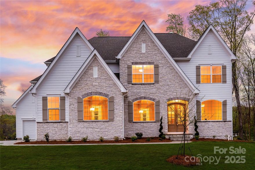 Indulge in unparalleled luxury with this rare opportunity—a brand-new custom-built waterfront estate on Lake Wylie, offering over 100 feet of dockable shoreline. Designed for elegance and effortless lakefront living, this exceptional home provides 4,295 sq ft of thoughtfully designed space with 5 spacious bedrooms, 4.5 baths, and an expansive 2,152 sq ft unfinished basement awaiting your personal touch. Entertain effortlessly in the sophisticated two-story Family Room featuring a custom fireplace and seamlessly connected gourmet kitchen, large island, walk-in pantry, and stunning lake views. Retreat upstairs to your tranquil Owner’s Suite showcasing peaceful water vistas, a spa-like bath, and a generous $12,000 seller credit for customizing your spacious owner's closet. Three additional bedrooms upstairs each feature ensuite baths. Step directly from your deck and patio to your private lakeside haven. Community amenities include clubhouse, fitness, two pools, and more!