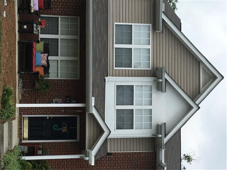 Charming 3 bedroom and 2 1/2 bath Townhome in the friendly community of Arlington Downs located in the Matthews/Stallings area.  This stunning home features brick accented exterior with a rocking chair front porch.  The inviting open floor plan has laminate hardwoods in the great room with a gas corner fireplace.  Enjoy the relaxing outdoors on the cozy patio overlooking the peaceful wooded back yard.