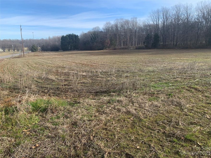 Just REDUCED. Old Farm tract.  Approximately 8.29 acres of vacant land.  Zoned R-1.  Field is currently planted in winter Wheat but also have woods on this parcel.  Could possibly make a subdivision if proposal was reviewed and approved by the county or build your dream home with some decent acreage.  Farm Buildings to the right of the property are no longer in use and working equipment has been removed, just used as storage.