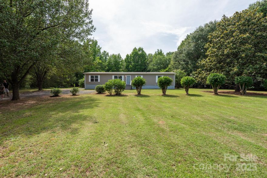 Just minutes from downtown Clover, this charming 4-bedroom, 2-bathroom home offers a perfect blend of privacy and functionality with its partially open floor plan. This home offers the freedom of no HOA fees, providing you with flexibility and control. The property features two outdoor buildings, ideal for additional storage or a workshop, and a spacious, fenced-in backyard perfect for entertaining or relaxation. The beautiful front yard adds curb appeal and creates a welcoming atmosphere. Inside, you'll find recent upgrades including new carpet, stylish LVP flooring, freshly painted walls. This home offers the best of both worlds—privacy and convenience.