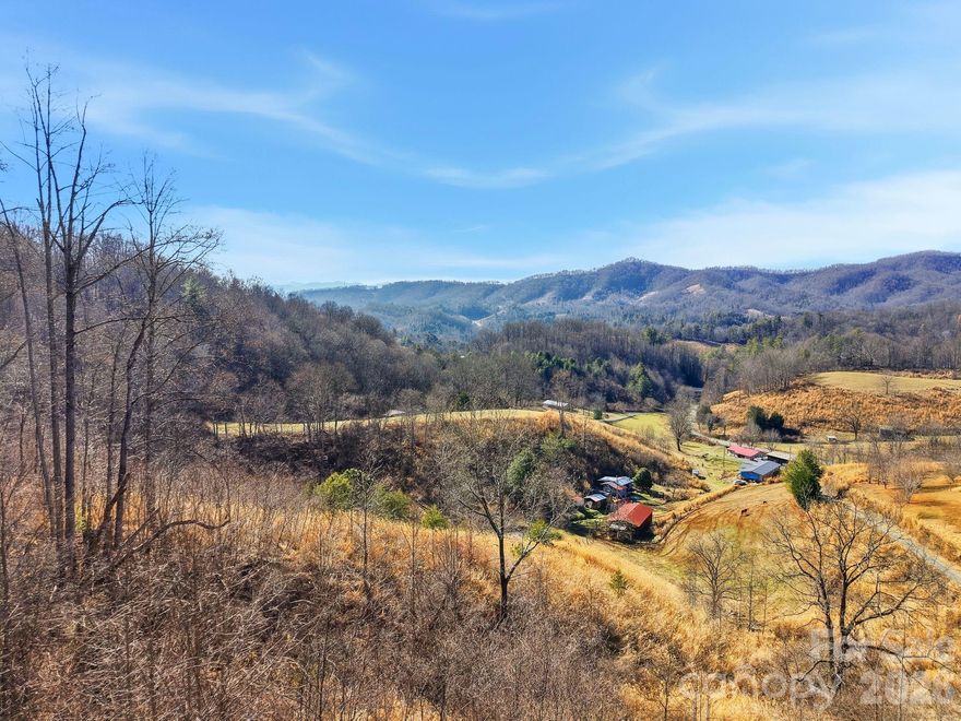 Tucked between Marshall and Mars Hill, this beautiful 5.86-acre parcel offers the perfect blend of rolling topography and stunning mountain views. This land provides multiple potential homesites, allowing you to choose the ideal setting to capture long-range vistas and breathtaking sunsets.
The natural landscape features a lovely mix of open areas and wooded sections, creating a peaceful environment while still offering usable land. Conveniently located with easy access to both Marshall’s vibrant arts scene and Mars Hill’s small-town charm, as well as a reasonable drive to Asheville, you can enjoy mountain living without sacrificing accessibility.
Whether you are dreaming of building your forever home, a vacation getaway, or an investment property, this exceptional acreage provides a rare opportunity to own a scenic slice of Western North Carolina.