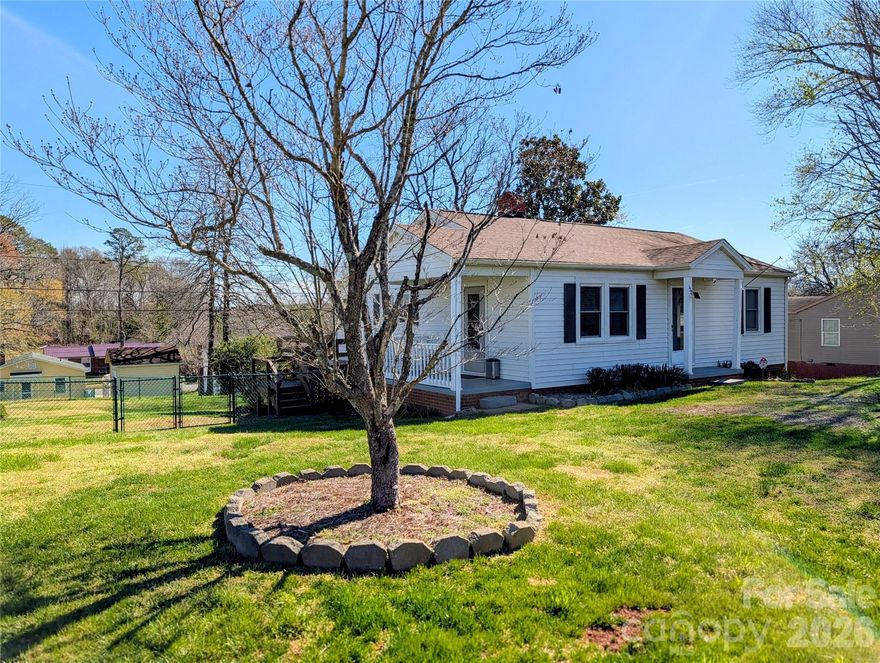 Start the new year in a new home! This charming 2-bedroom, 1-bath property is perfectly located within walking distance of downtown Morganton and just one mile from the interstate and hospital.

Beautifully maintained and recently updated, this home features newer windows, roof, HVAC, and fresh paint. The dedicated dining room offers flexibility and could easily be converted into a third bedroom.

Enjoy a spacious living room and an eat-in kitchen with stainless steel appliances—ideal for entertaining. Both bedrooms are generously sized, providing comfort and functionality.

Step outside to a fenced backyard, perfect for pets, and relax on the back deck while you watch them play. Move-in ready and complete with all window blinds included, this home truly has everything you’re looking for!