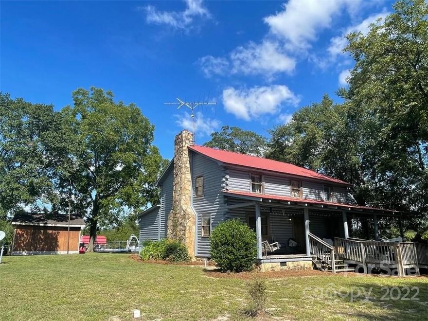 RARE OPPORTUNITY TO OWN THIS MAGNIFICENT PROPERTY...92.20 ACRES, 2900 Sq. Ft. home with 5 bedrooms 3 1/2 baths.. stone fire place...  GORGEOUS HEART PINE FLOORS... wood beams, log walls and wood ceilings. This is not  your everyday home.  Master suite has a jacuzzi and walk in closet. Formal dining room. Darling kitchen with brick floors and rustic cabinetry.  Relax on the front porch, out by the pool or laying in a hammock under one of the towering trees in the front yard. Or,, maybe down by the pond . HUGE inground pool... POND... pastures...woods...
SO many features....WOW is all I can say.. Motivated Seller