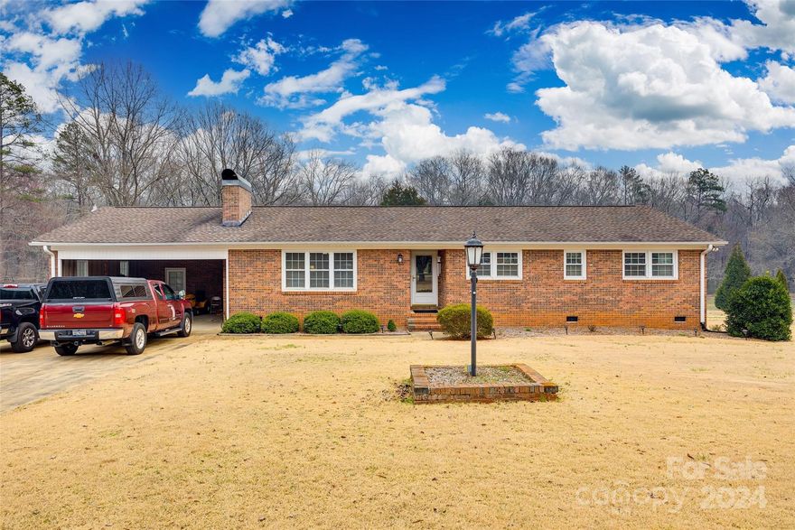 Discover the allure of this secluded ranch retreat. The concrete driveway leads to the heart of the property, where a charming ranch home sits surrounded by open skies above and wooded property lines below. The typical ranch architecture is apparent from the outside but inside, the layout creates a timeless and tranquil atmosphere. Inside, you'll find a well-appointed kitchen, a cozy living room in the front with a fireplace and a family room at the rear of the home. There are 3 spacious bedrooms with 2 full bathrooms providing an ample area for entertaining and making memories. Step outside once again to enjoy nature at its finest, with perhaps the perfect spot for stargazing on clear nights--the deck on the back of the house. This secluded ranch home is more than a residence; it's an invitation to embrace the peace and beauty of this property as was done by the previous owner for ~30 years. Schedule a showing today