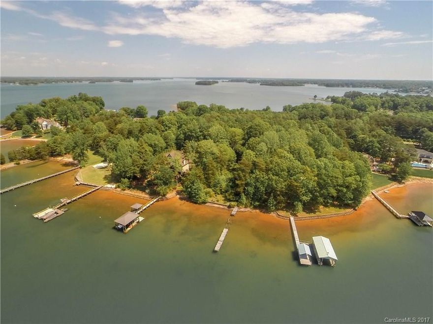 Ahhh...the wide-open views of beautiful Lake Norman on this premier waterfront lot on Jetton Road. ~180' of shoreline. Surrounded by multi-million dollar homes, where you can clear the lot and build your dream estate. No HOA restrictions. Adjacent to The Peninsula, with memberships available for world-class golf, tennis, Yacht Club and restaurants. Existing dock will need to be replaced, with permit required from Duke Energy. City water and sewer available with tap fees. Impervious is non-issue!