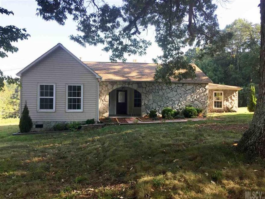 Adorable Ranch Home offers: Family Room with wood flooring and a gorgeous gas-log fireplace with stone surround and wood mantle; Spacious Dining Room with molding; Kitchen with beautiful wood cabinetry, tile counters, new electric range and vent hood; MBR with new carpet and large walk-in closet; Huge MBA with tile flooring, single vanity, tub/shower combo and laundry connections; 2 Secondary bedrooms with wood flooring; Shared Bath with tile flooring, shower only and single vanity; Freshly Painted interior and exterior; Vinyl Replacement Windows throughout; Water Heater replaced 2015; Exterior has stone, vinyl and vinyl trim; Storage Building included; Circular gravel drive; And a really nice, level corner lot!