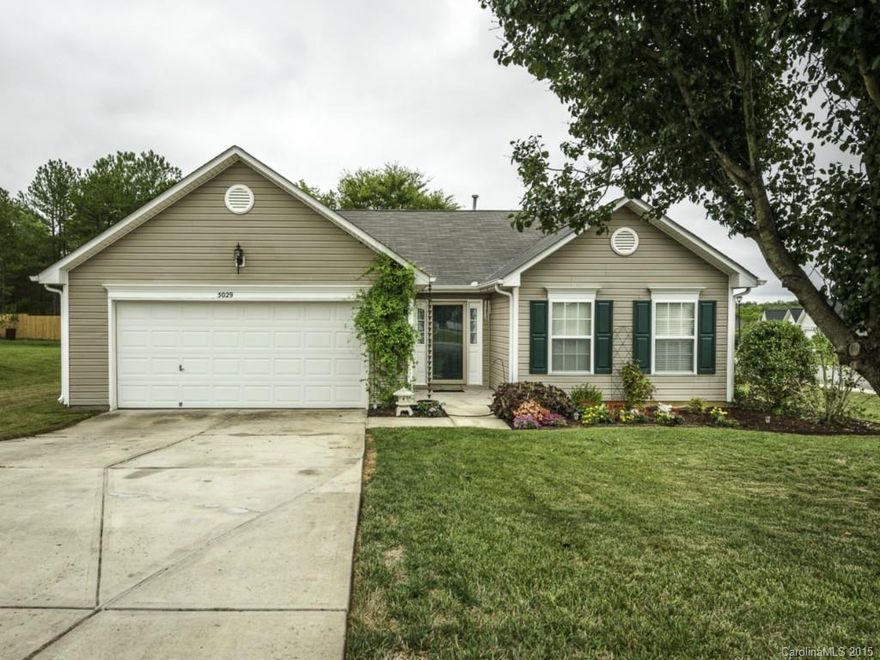 Alluring Move-In Ready 3 Bedroom 2 Bath Ranch Home on a Large Corner Lot! Visit this Inviting Split Floor Plan w/Vaulted Ceilings in Great Room, Flowing Nicely into a Terrific Kitchen w/Island & Breakfast Bar. Bedrooms Situated well for Privacy! Tile in Bathrooms & Kitchen. Wood Floors in Hallways & Carpeted Rooms. Beautiful Updated Mstr Shower with Tile/Stone with Bench Seating. Perfect Patio in Back w/Fenced Yard! Great Backyard for Entertaining! 1 Yr AHS Home Wrnty and $500 Carpet Allowance.