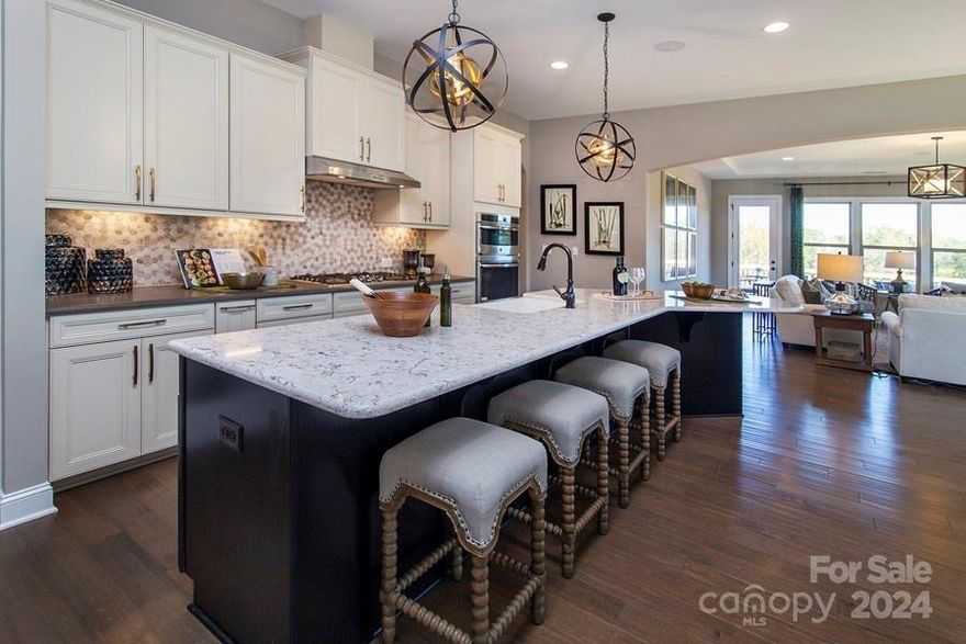 MLS#4180766 REPRESENTATIVE PHOTOS ADDED. Winter Completion! The Whitmore II at Estates at Sugar Creek boasts a generously designed ranch layout with an open-concept living area. The spacious gathering room seamlessly connects to a casual dining area and a unique kitchen featuring a boomerang-shaped island. Near the foyer, you'll find a formal dining room, while a flexible room and walk-in closets in the secondary bedrooms provide versatile storage options. The owner’s suite offers a luxurious retreat with a large walk-in closet, dual sinks, and a grand walk-in shower. Upstairs, enjoy added living space with a loft, an attic suite, and a game room. Structural options added include: screened covered outdoor living, and gas fireplace in the great room, gourmet kitchen, and loft W attic suite and game room.