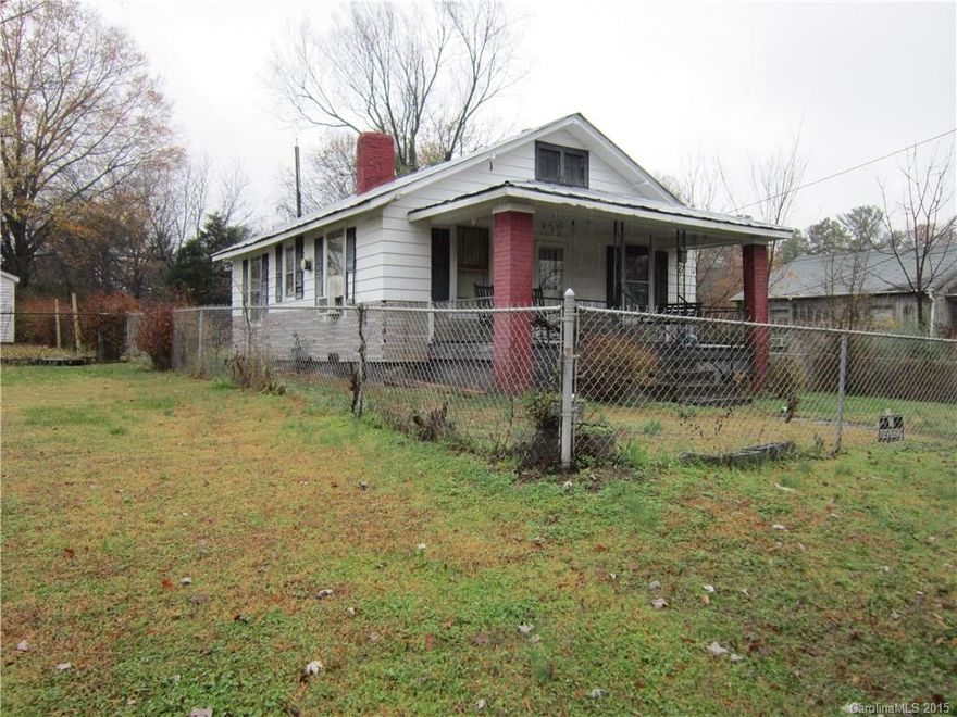Seller is selling in "as is" condition; Good investment property; fenced yard with gate for driving vehicle in.  No garage; Outbuilding must be torn down; Small cottage type house has aluminum siding and some vinyl siding;
Two bedrooms, one bath.