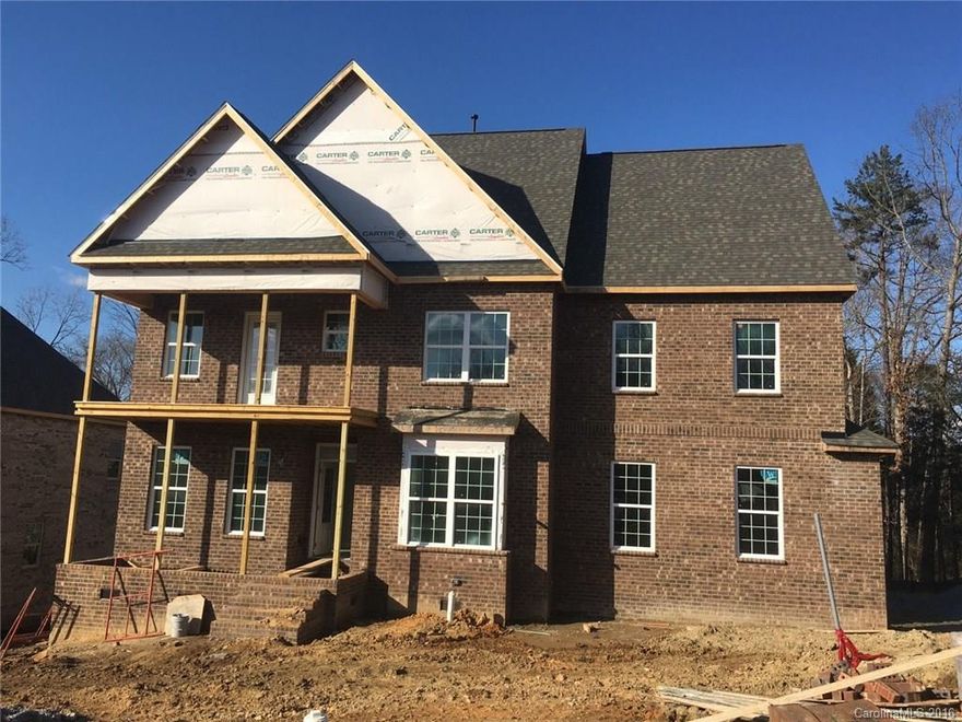 TO BE BUILT! Beautiful Brick Home w/2-Car Side Entry Garage & Double Front Porches! This home features Both Formals, Guest Suite on Main & 5” Hardwood Floors in main living areas. Great Room opens to Kitchen w/42" White Cabinets, Granite Countertops, Tile Back Splash & SS Appliances, including Gas Range. Upstairs you'll find a luxury Owner's Retreat w/gorgeous Bath, Tray Ceiling & Walk-In Closet, 3 add'l Bedrooms & Bonus Room. The 12x14 Deck is perfect for gatherings. Lake Wylie Nearby!