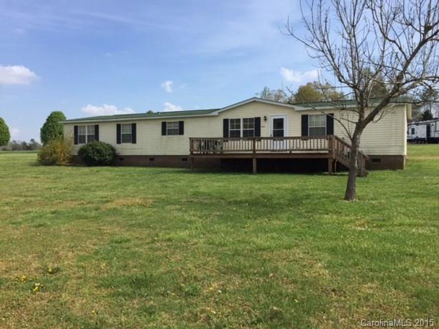 Large home in Gold Hill sitting on  1.33 acres.   This 4/5 bedroom 2 bath home has tons of space.  Large master suite with separate sitting or office area.  Large living room with fireplace.  Eat in kitchen and separate dinning area.  Large front deck to enjoy country living.