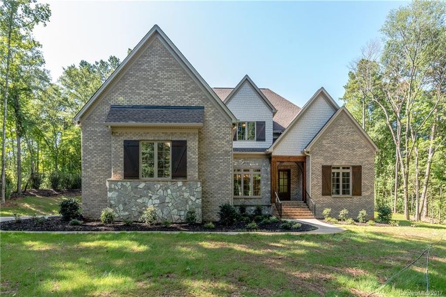 REDUCED! PRICED TO SELL-Bring Offers! Motivated Seller! Newly completed custom home w/ tons of upgrades! Private wooded 5.6 acre cul-de-sac lot is a rare find especially in gated community. Minutes to NC line & Ballantyne area, but enjoy low SC taxes. Master & Guest suites on main level, gourmet kitchen, custom cabs, HUGE island & brkfast room. NEW 42" Fridge included! Upper level w/ 3 more BR's, all en suite, plus loft, bonus rm & huge flex space. Private covered lanai. An oasis!