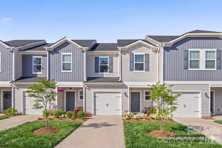 Built in 2023, this beautifully maintained townhome offers modern finishes and low-maintenance living in a highly desirable Fort Mill location. The open-concept main level features durable vinyl plank flooring and a bright kitchen with stainless steel appliances, a large island, and stylish lighting—perfect for everyday living and entertaining.
Upstairs, you’ll find all bedrooms along with a convenient laundry area. The spacious primary suite includes a double vanity and an oversized walk-in shower. Secondary bedrooms are comfortably sized with carpet for added warmth.
Step outside to enjoy the paver patio—ideal for relaxing or enjoying your morning coffee. Lawn maintenance along with HOA managed exterior upkeep is just a few of the perks from living in Ashe Downs.
A great opportunity to own a nearly new home with modern design, functional layout, and minimal upkeep!