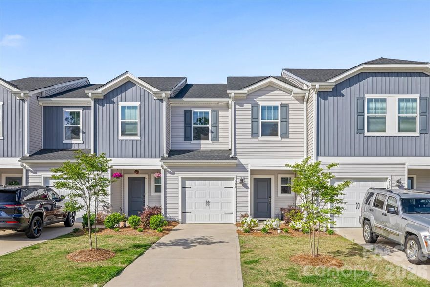 Built in 2023, this beautifully maintained townhome offers modern finishes and low-maintenance living in a highly desirable Fort Mill location. The open-concept main level features durable vinyl plank flooring and a bright kitchen with stainless steel appliances, a large island, and stylish lighting—perfect for everyday living and entertaining.
Upstairs, you’ll find all bedrooms along with a convenient laundry area. The spacious primary suite includes a double vanity and an oversized walk-in shower. Secondary bedrooms are comfortably sized with carpet for added warmth.
Step outside to enjoy the paver patio—ideal for relaxing or enjoying your morning coffee. Lawn maintenance along with HOA managed exterior upkeep is just a few of the perks from living in Ashe Downs.
A great opportunity to own a nearly new home with modern design, functional layout, and minimal upkeep!