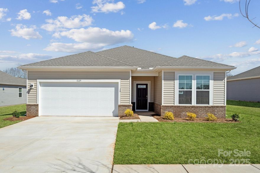 The single-story ranch Oakleigh plan offers a thoughtful open-concept layout. A generous kitchen with a center island and corner pantry overlooks an elegant dining area and generous great room. A spacious primary suite features a roomy walk-in closet and an attached bath with a separate tub and shower. Toward the front of the home, the foyer leads to three secondary bathrooms that share a full hall bath.