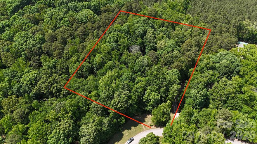Discover a fantastic opportunity to own 2.02 acres of private, versatile land in the established Frontier Circle neighborhood of Indian Trail. This combined two-parcel property offers plenty of space for your custom dream home. A portion of the lot is in a flood fringe area, while the majority — particularly the back portion — is suitable for building.With 2.02 acres, this lot delivers significantly more land than typical parcels in the area — ideal for a spacious family residence, garage, workshop, gardening, or simply enjoying the extra privacy and natural surroundings.Frontier Circle is a peaceful, mature neighborhood of custom single-family homes on generous lots, offering a quiet, family-friendly atmosphere with room to grow. Indian Trail provides the perfect mix of suburban convenience and relaxed living. Commuting is easy — just 25–45 minutes to Uptown Charlotte, SouthPark, or the airport, and only minutes from major highways like US-74 and I-485.