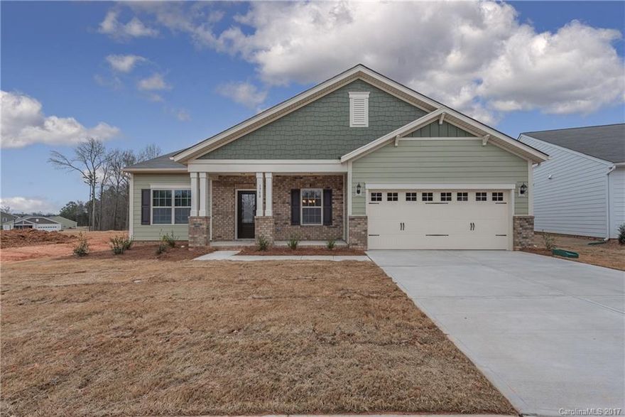 This home is located directly in front of the community green space on a beautifully wooded homesite. Enjoy ranch style living w/ an open living spacew/ kitchen, breakfast + DR at its core. The powder room is at the front of the home near the dining room and a study accessed through French doors. Home features hardwoods, large Kitchen Island w/ raised bar, gas/convection cooking and  tile backsplash  spacious walk-In closets;