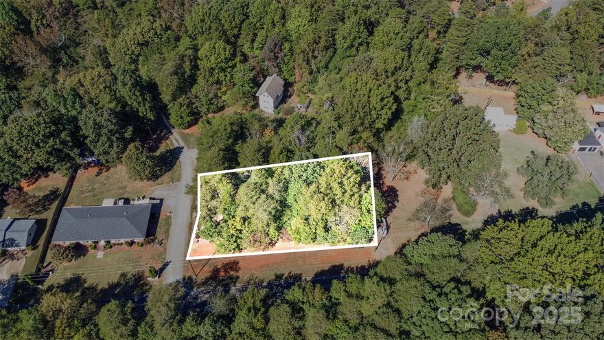 Incredible opportunity to own a residential lot in one of Charlotte’s most desirable and rapidly developing areas. Nestled on a quiet street with no HOA, this property offers the freedom and flexibility to design the home of your dreams without restrictive covenants. Enjoy the best of both worlds – privacy and convenience. You're just minutes from beautiful Lake Wylie, Berewick Shopping Center, Charlotte Premium Outlets, and the highly anticipated River District development that's set to bring even more growth, dining, recreation, and lifestyle perks to the area. Whether you're envisioning a custom primary residence, a serene weekend retreat, or an investment build, this lot puts you right in the center of it all. The lot is ideal for a custom home, and a percolation test is already scheduled, making it easier to move forward with your building plans. With no HOA restrictions, you can choose your own builder and architectural style, take full advantage of the natural surroundings, and truly make the space your own.
Opportunities like this are becoming increasingly rare in Charlotte's booming southwest corridor. Secure your slice of land while it's still available and start building your future today.