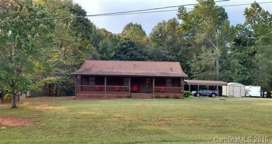 All stats per seller to be verified by buyer/buyer's agent! Immaculate log home that is move in ready! Wonderful screen porch addition, updated kitchen counter tops/back splash, fenced backyard, nearly 2 acre lot, storage building and double carport, beautiful log interior walls, rocking chair front porch, very convenient location off of Hwy 16, call today!!