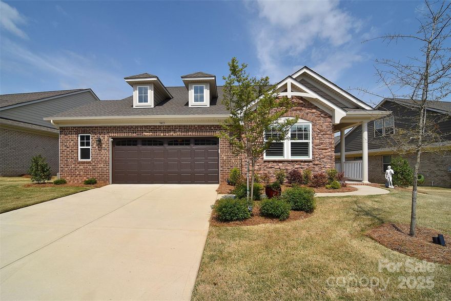 This stunning Armstrong plan is a highly sought-after gem, offering many luxurious extras that are sure to please the most discerning buyer! The beautiful covered front porch welcomes you into a spacious foyer with decorative molding. The front bedroom, complete with an en-suite, provides privacy. The immaculate open great room, kitchen, dining area, and cozy sunroom blend seamlessly together, perfect for relaxing or entertaining. A majestic corner stone gas fireplace adds warmth on chilly nights. The kitchen is a culinary haven with a large center island, beautiful quartz countertops, upgraded light fixtures, and stainless steel appliances. The primary suite boasts a beautiful en-suite with a spacious shower spa with ‘rain glass’ and an expansive custom closet system you will love! Residents of Sonata also enjoy a range of amenities, including an outdoor pool, clubhouse, pickleball courts, and scenic walking trails, and lawn maintenance, making this home a true haven.