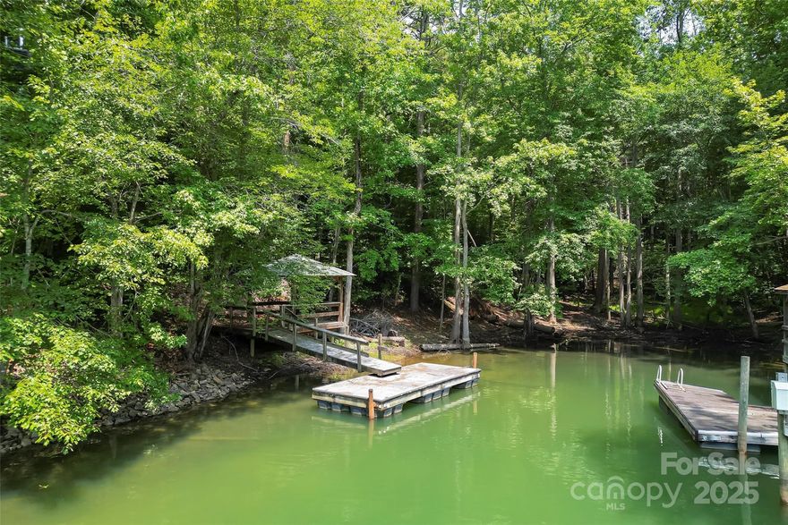 PRICE REDUCED!

A Rare Opportunity at Lake James!

This is your chance to own a stunning waterfront property on the beautiful shores of Lake James! Recently cleared of fallen debris, the pathway to the lake now features newly built footbridges, providing easy access to the gazebo and dock. Whether you're looking to build your dream waterfront home or simply enjoy the serene beauty of the lake, this lot offers the perfect setting.

Nestled in a peaceful cove, this wooded lot provides privacy and tranquility, with the gazebo and dock already in place for immediate enjoyment. Southpointe is a highly sought-after community, ideally located near Morganton, the Linville Gorge, and the Fonta Flora Trail, making it a perfect spot for outdoor enthusiasts.

Residents of Southpointe enjoy exclusive amenities, including a clubhouse, social activities, an outdoor pool, and walking trails. Don't miss out on this exceptional opportunity to make your dream home a reality!