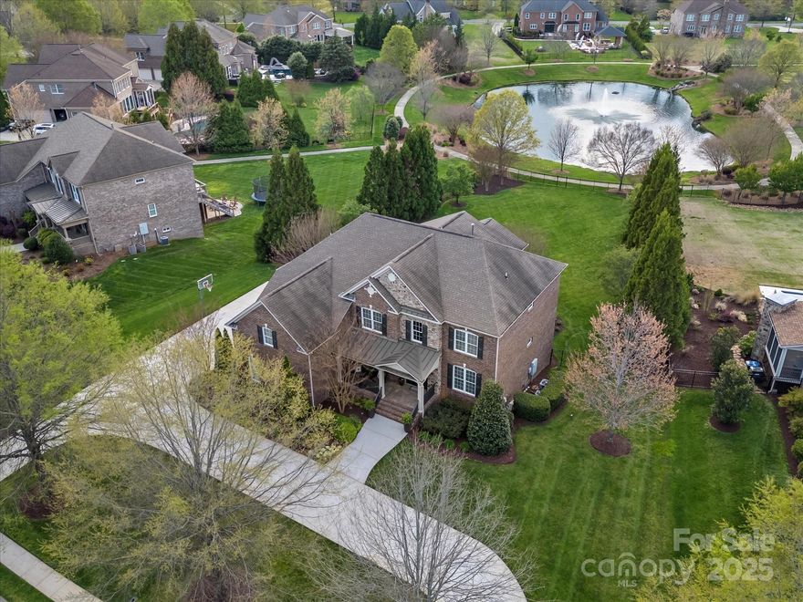 Welcome to Elegant & Luxurious WATERVIEW residence awaits its new owners. Boasting an impressive 6,071 sq Ft w/refined space on a .71 Acre lot. This home is a perfect blend of sophistication and comfort. HUGE Gourmet Chefs Eat in Kitchen and Breakfast Area compliments the Open Floor Plan. Featuring 6 lavish bedrooms w/ 5 exquisite bathrooms. Enter w/ Architectural Elegance continues with a Sweeping staircase and 2 Story GRAND soaring ceilings. Stunning primary bedroom, featuring a sitting area and custom closets, upgraded Bath to feel like a spa day. Plus an outdoor kitchen w/ Firepit meticulously designed for gastronomic adventures. Entertainment flows seamlessly into the screened-in porch (Flat backyard)  which overlooks a Serene pond with Fountain. Meticulously landscaped Professional premium lot. Basement is smartly outfitted with a kitchenette, living Room w/ Fireplace/2 Recreation rooms, Flex space,  perfect for hosting soirées or intimate gatherings. Plenty walk in storage.