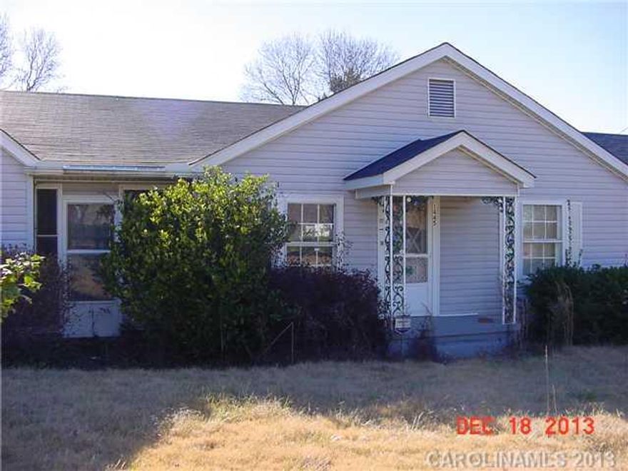 vinyl sided home on nice lot in country setting, 2 to 3 bedrooms, other storage rooms; property sold as-is