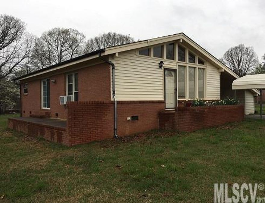 Beautiful home in NE Hickory! Spacious home with vaulted ceilings, over head storage in bedroom and hallway. Hardwood floors in living room, hall, and bedrooms. In addition to the fan forced furnace, also has secondary wall units. Includes bonus room with built in book shelves and entertainment center, with a raised brick patio for entertaining. Out building included has power. Laundry/Utility room is located outside beside the attached carport with extra storage closets. Don't miss this one. Motivated seller!
