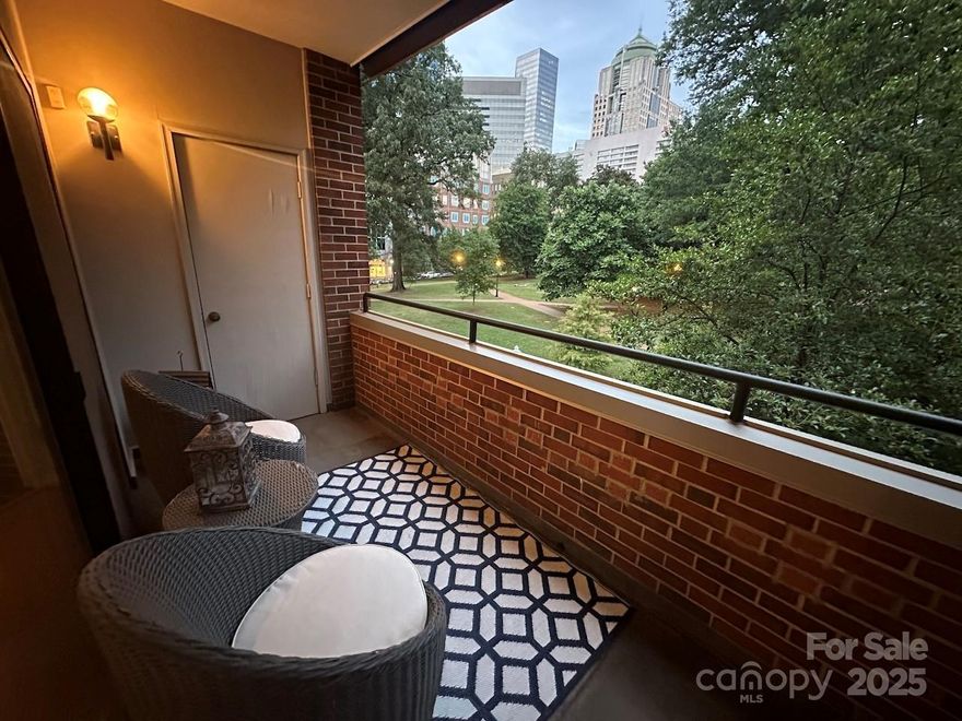 Excellent location situated perfectly between Uptown and Fourth Ward with fantastic views of the City Skyline and Settlers Park.  Walk to restaurants, theater and sports. The unit's layout has the feel of a home more than an apartment or condo that is perfect for entertaining. So much natural light.  The living areas are large and open with a spacious balcony and storage closet.  The primary and guest bedroom are spacious with access to the 2nd of 2 balconies overlooking the park/cemetery.  The guest bathroom is a good size and has a laundry closet with stackable w/d.  There is a 3rd room that can be used as a bedroom or an office.  Not afraid of reno? - open up the kitchen to the living areas (see floor plan photo.  (This has been done in a few of the other units with the same floor plan- ask agent for more info). Fridge, washer and dryer are included. 
1 deeded parking space in the secure garage.   HVAC replaced 2021.  New roof and Exterior Building Facade Project completed in 2021.