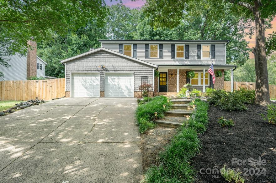 Welcome to 6631 Rollingridge Drive, a modern and elegant 4-bedroom, 2.5-bathroom home nestled on a corner lot in the beautiful Waverly Hall neighborhood. This stunning property boasts 2,011 square feet of living space, featuring a spacious kitchen with a pantry and new stainless steel appliances. The main level showcases a living room with a cozy fireplace, a separate dining room, and a convenient laundry area. Upstairs, you will find 4 bedrooms that boast of new LVP and new carpet floors. The 2-car attached garage, 2022 HVAC, and 2019 hot water heater offer added convenience and peace of mind. Outside you will find incredible amounts of shade from the trees, a new privacy fence, a greenhouse, a separate area with a vegetable and fruit garden.. a true outdoor oasis! New windows and gutter guards, along with parking, complete this exceptional Charlotte gem.