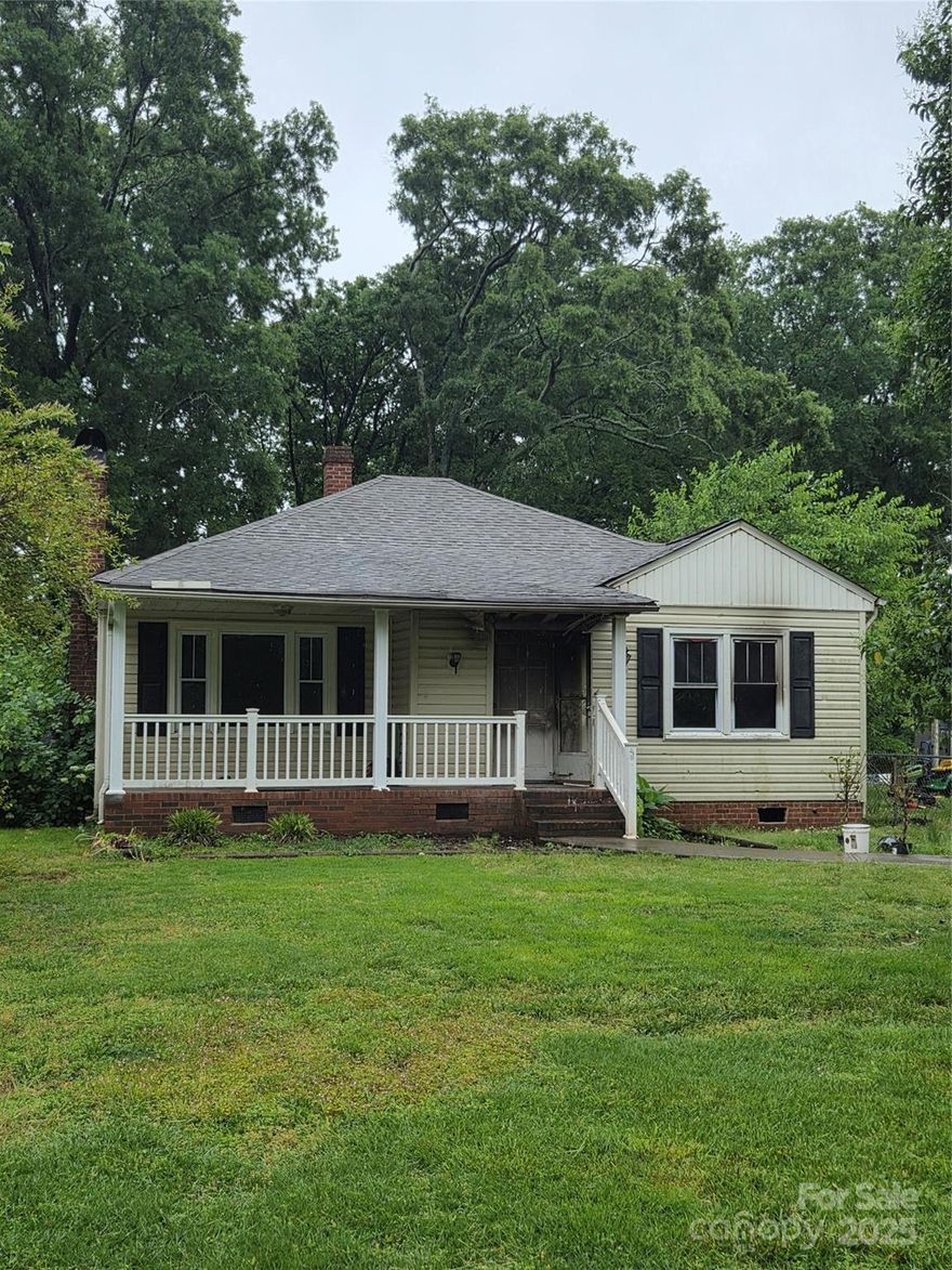 Home has been cleared of all debris.  Tons of potential in this ranch bungalow a half mile from downtown Rock Hill!  Will make for a great rental or flip in fast appreciating Rock Hill just 30 minutes from Uptown Charlotte.   Home to be sold "as is" due to recent fire contained in laundry room & kitchen.   Overall good bones but will need repairs mainly on right rear of home. New roof in 2024 will need minor repair.