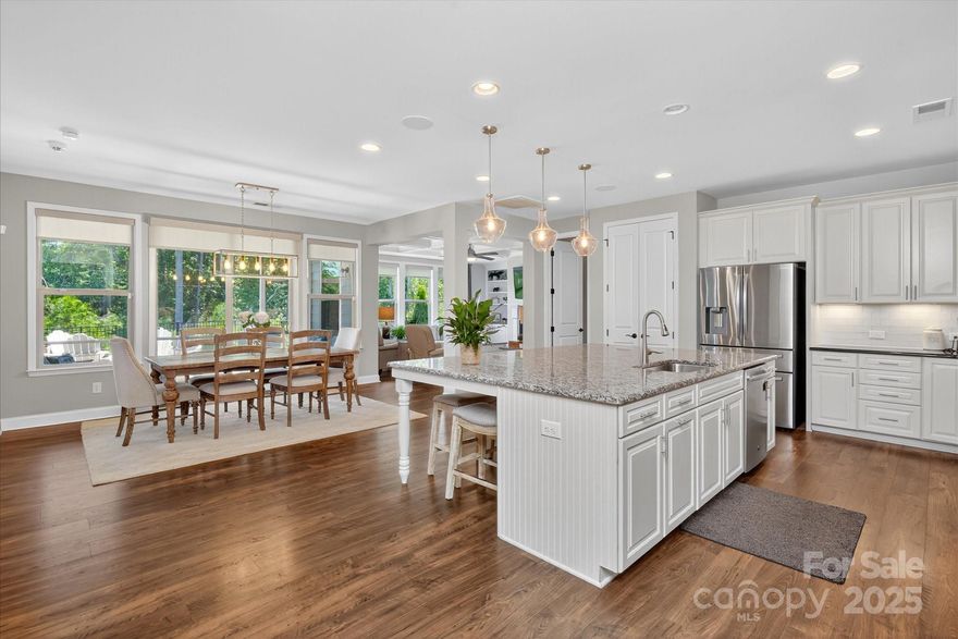 STUNNING! Single story/ranch home is perfectly positioned on Quinebaug Road, backing to a lush, wooded area offering a peaceful, natural backdrop! Step inside & discover a thoughtfully designed open-concept layout, ideal for daily living & entertaining. MANY upgrades such as built-in shelving in GR w/coffered ceiling, upgraded flooring throughout & recessed lighting You will be BLOWN AWAY by the GORGEOUS & EXPANSIVE chef's kitchen w/gas cooktop, SS appliances & upgraded counters & cabinetry. Luxurious primary suite is a true retreat, featuring serene views of the backyard & elegant en-suite bath w/a grand shower. All bedrooms w/ensuite baths! Outdoors, enjoy a fully fenced-in backyard w/irrigation & upgraded landscaping. Located in desirable Massey offering exceptional amenities: clubhouse, fitness center, outdoor pool, playground, sidewalks, & more. This home is BEAUTIFUL & MOVE-IN READY! Don’t miss your opportunity to own a slice of tranquility in a vibrant, amenity-rich community.