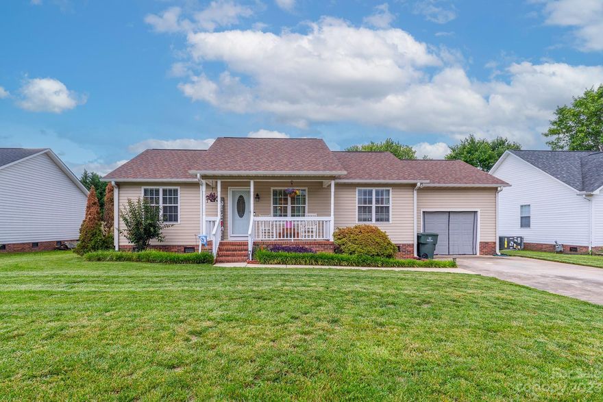 This adorable house is picture perfect & move-in ready! All the updates have been done for you! The heart of the home features a beautifully updated kitchen with granite countertops, tile backsplash, island, SS appliances, & tons of storage. Great open concept living room with vaulted ceiling, & lovely prefinished wood flooring throughout main. Added bonus room adjacent to kitchen offers endless possibilities. Ideal split floor plan with granite countertops & tile flooring in both bathrooms. Nice flat .24-acre lot boasts fully fenced backyard w/large 25x25 patio area, shed, covered front porch, & ample parking with extended driveway. BRAND NEW HVAC 3/2023, Roof 2017, freshly painted interior. Location..Location..Location..Walk to elementary, minutes to Concord Mills, Charlotte Motor Raceway, Restaurants & Highways. And NO HOA!! Don't miss out on this opportunity.