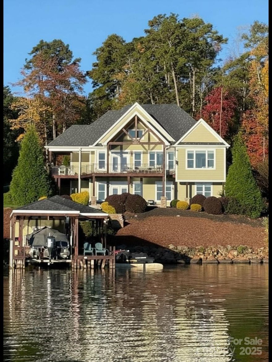This beautiful Lake Tillery home is all about spectacular views!     This stunning 5BR/4.5BA home offers panoramic main channel views and deep water access. The great room features floor to ceiling glass, cathedral ceilings and an open flow to the kitchen and spacious dining room! The kitchen has white cabinetry with granite countertops and a center island.    The lovely main-level primary suite is a true retreat with breathtaking views. The bathroom has a free-standing tub, separate water closet and a walk-in closet. The bedroom has access to the incredible views of the lake from the covered porch and grilling alcove.    Oh, and don't miss the large bonus/bedroom with full bath over the garage level.  
The lower level includes a expansive den with kitchenette, 3 bedrooms and 2 baths.  2 of the bedrooms offer views of the lake!  
Step outside to a covered patio, and an amazing hot tub from which to soak in the view too!    On the way to the dock is a built-in firepit and seating that welcomes you gather with friends and make s'mores!    The boathouse has a lift and storage room. There is also an oversized 2-car garage. The floor plan is a modified Whitcomb by well known Donald Gardner. 
   This is a rare opportunity to own a move in ready home in Edgewater at Lake Tillery!    Don't miss out!   Welcome to lake living!