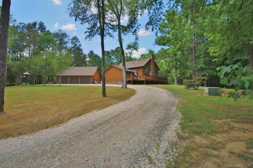 Incredible opportunity to own a custom log home on 15+ acres with total seclusion.  This  home boasts a stunning 2 story great room w stone fireplace, an open gourmet kitchen with Bosch/Thermador SS appliances, master on the main & hardwood floors throughout.  Step outside to extensive decking to enjoy the outdoors with total privacy.  A 30X40 detached three car garage w unfinished 2nd level that could be finished for an apartment is a bonus.  Easy access to I-85.