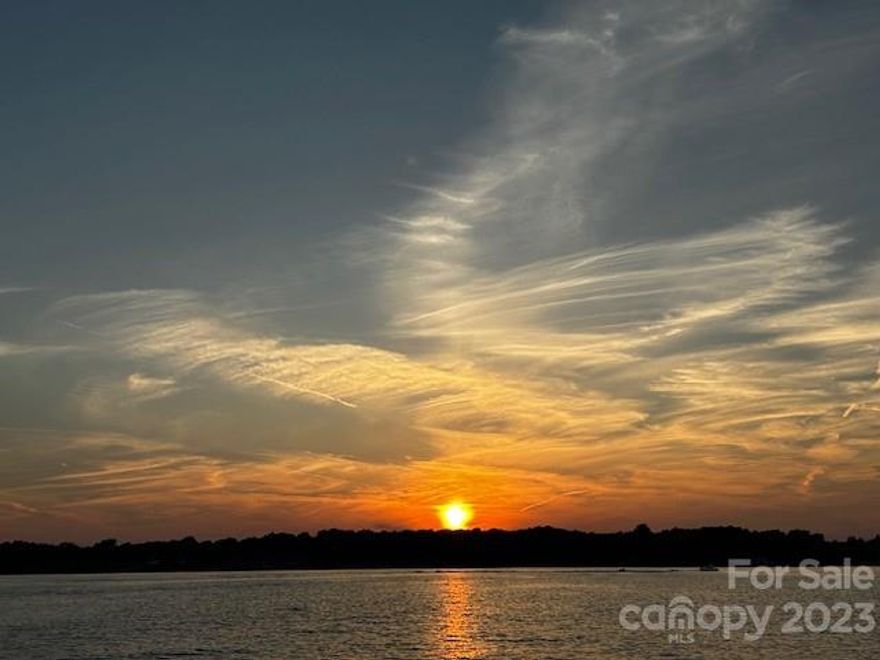 WATERFRONT! Lake Wylie- Stunning Fully renovated 2-story w 3 Beds - 3 full baths Spacious open concept for entertaining & comfortable living. No expense was spared +$125k luxurious upgrades & 2 decks to spend lazy afternoons or entertain guests. Enjoy the beautiful LAKEFRONT views of Lake Wylie & Brown's Cove. On the main floor, you'll find 2 beds & 2 full baths, an open-concept kitchen w/granite that includes a dining area & service bar. The living area boasts a custom stone woodburning fireplace & hutch. The upper deck, with stunning lake views, is perfect for morning coffee or afternoon relaxation. The large lower deck & living area offers a spacious guest bedroom, large closet with a custom closet design, a bonus room & full bath. A bonus to sweeten this deal: you can purchase it fully furnished! Turnkey décor & furniture package and a 22' Pontoon with a lift for sale - dock #73. NOTE: Online & Zillow estimate is based on 1-story smaller units. Online Estimates LOW-NOT ACCURATE.