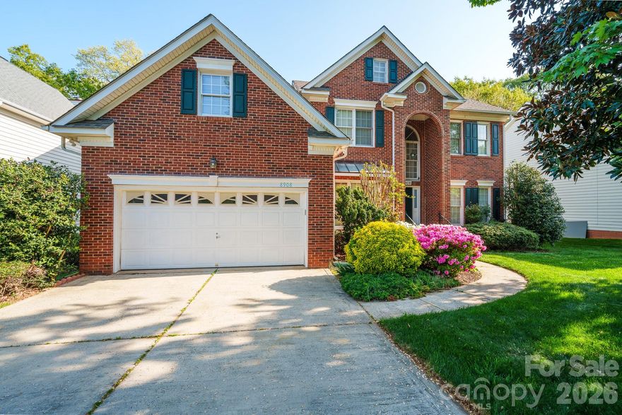 Immaculate, true 5-bedroom brick-front home in the heart of Ballantyne, featuring a highly sought-after main-level primary suite, a spacious 2-car garage, and a large, flat, private backyard backing to mature trees—offering the perfect setting for a future pool or outdoor retreat.

The main level welcomes you with a light-filled two-story foyer, elegant formal living and dining rooms with decorative molding, and a stunning two-story family room with a gas fireplace. Beautiful Brazilian hardwood floors add warmth and sophistication throughout the main living areas.

The updated white kitchen is both stylish and functional, complete with granite countertops, abundant cabinetry, and a spacious breakfast nook surrounded by windows. Enjoy seamless indoor-outdoor living with direct access to the deck—ideal for entertaining or relaxing.

Upstairs, you’ll find generously sized secondary bedrooms and a versatile bonus room or fifth bedroom, perfect for a media room, playroom, or guest suite, along with walk-in attic storage.

Beautifully landscaped with irrigation in both the front and backyard. Located in a prime South Charlotte location within top-rated school districts and just minutes from shopping, dining, and major highways.