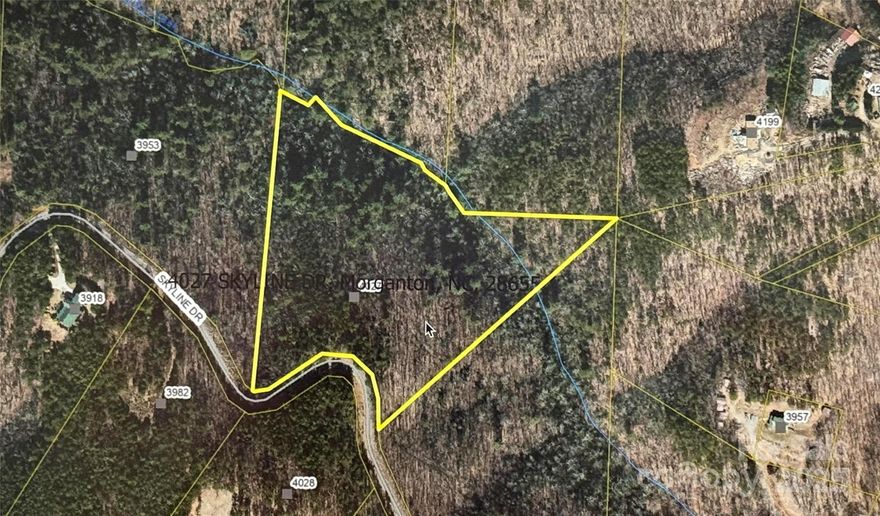 Beautiful 10.33 acre property in gated community close to I-40 and mins from Downtown Morganton. Enjoy the low HOA'S, no city tax and gated community. This land offers privacy and a stream!  The community consists of both full-time and part-time residents. Burke County is a mecca for outdoor lovers, offering hiking, biking, kayaking, fishing, and several nearby public lakes. Located near the entrance of the community, enjoy an easy drive to this land! Already obtained perc for septic.