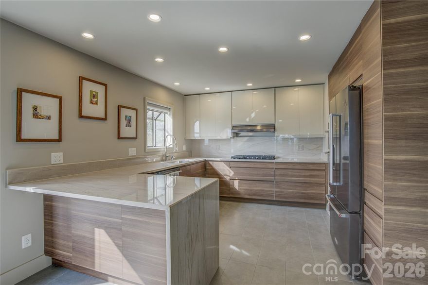STUNNING VIEWS! If you’ve ever dreamed of a move-in-ready condo offering long-range mountain views to enjoy from your couch, this is your chance. This beautifully renovated, uniquely modern 3-bedroom, 2.5-bath condo offers sweeping year-round views—and the ultimate mountain retreat lifestyle. Inside, you’ll find light-filled space, including an expansive living room with vaulted ceilings and a stone fireplace, a sunroom for relaxing or entertaining, and a loft with skylight and half bath—perfect for a guest area or office. The kitchen is a chef’s delight, with a 5-burner gas cooktop, breakfast bar, and a water filtration system right at the sink. The outside covered carport provides EV charging. You’re just 15 minutes to downtown Hendersonville and 25 minutes to the Asheville airport, with nearby access to hiking, dining, and cultural landmarks. Come see this one today!