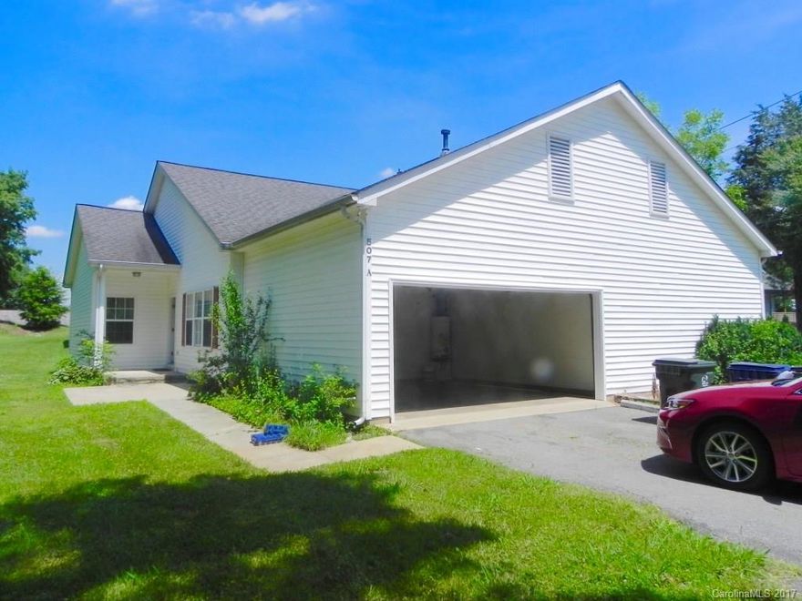 Completely refurbished 3bdrm, 2 bath, 2 car garage duplex.  New flooring and new paint throughout the home.  Large yard and private side porch.
