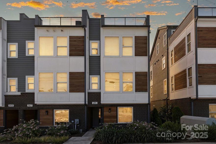 Nestled in the heart of Wesley Heights, this stunning end unit offers three bedrooms, two full bathrooms, and two half bathrooms. The third bedroom can be used as an office or a flex space. Thoughtfully designed with premium selections— stainless steel appliances and an updated custom closet in the primary bedroom. This home is a rare opportunity you won’t want to miss. The highlight? A spacious rooftop terrace with sweeping city views—the perfect spot for entertaining friends or relaxing after a long day. Location is everything, and this home delivers. In under a mile, you can be at Bank of America Stadium for a game, enjoying local restaurants and breweries, or hopping on I-77 North or South. South End is just minutes away, making this one of the most convenient addresses in Charlotte!