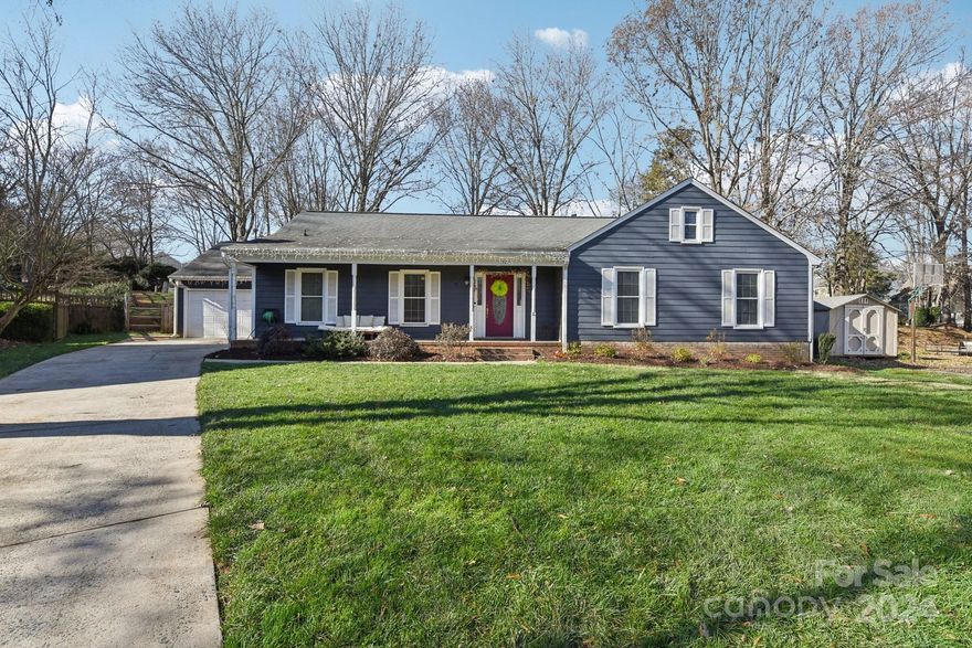 Lovely well-maintained ranch in amenity-rich Raeburn community! An adorable rocking chair porch welcomes you to your new home. Straight through the foyer you will see how wonderfully this home centers around a large open dining room w/fireplace. Step further into the updated kitchen with large island w/seating – fabulous for entertaining. A vaulted living/great room spans the back of home with skylights & gas fireplace for year-round enjoyment. In the front of the house is a private bedroom/office, primary suite, and 2 generous bedrooms on the hall off the foyer. Both primary and hall baths boast new vanity & new tile. An impressive primary bedroom features dual closets and ensuite bath. The private fully fenced back yard w/lush shade trees, patio, and custom landscaping is ideal for relaxing or entertaining. Large garage, exterior storage and attic. Enjoy Raeburn's outdoor pool, tennis court & walking trails while being so close to Ballantyne, Blakeney, Waverly, Stonecrest & I-485!