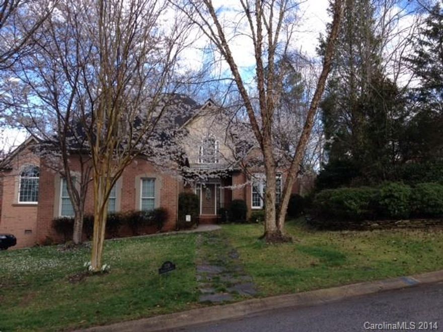 Situated on a private, heavily wooded, 1/2 acre fenced lot in the exclusive Anchorage neighborhood in Tega Cay! This full brick home offers beautiful hw flrs, main level master suite, 2 stry great rm w/stacked stone FP & private office w/vaulted ceiling, blt in bookshelves overlooking the deck & backyard. An ideal home office! Kitchen features include Viking 6 burner gas cooktop w/hood, Bosch DW, double oven for the chef; Granite tops, tile backsplash, eat-at bar. Don't miss the 700 sf workshop!