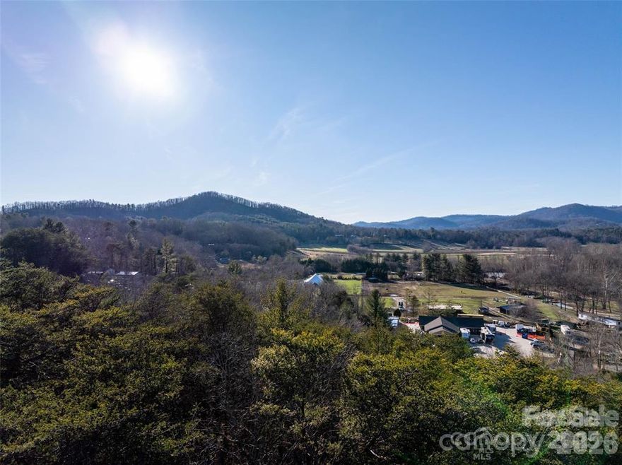 Prime 6+ Acre Parcel in Swannanoa – Minutes to Asheville & Black Mountain
Bring your dream home to life on this desirable 6+ acre parcel in the heart of Swannanoa. With sweeping long-range mountain views and buildable terrain, this property offers the perfect blend of natural beauty, privacy, and convenience.  Tucked away for a secluded feel yet just minutes from both Asheville and Black Mountain, this land presents a rare opportunity to create a private estate or mountain retreat. City water is nearby (buyer to confirm availability and connection options), and potential septic sites add flexibility for development. Currently part of a 17-lot subdivision plat, the property offers ample space and versatility to accommodate your vision—whether that’s a custom home, multi-generational homestead, or peaceful getaway.