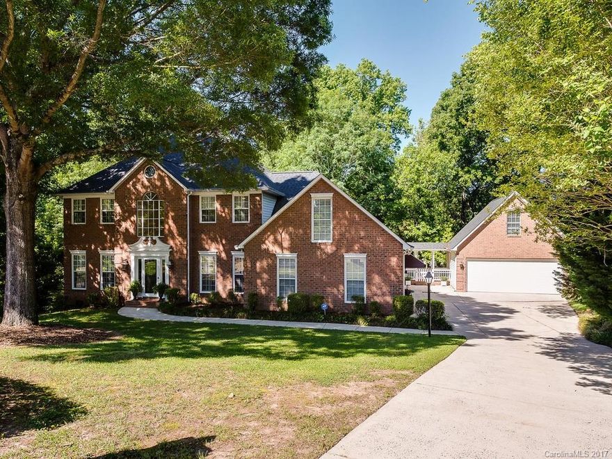 This stately home located on a tranquil cul-de-sac lot has so much to offer! Enjoy the downstairs master suite (incl. sizeable walk-in closet and direct access to deck), granite kitchen counters, downstairs bonus room, 2nd master bedroom up and unfinished recreation/storage room above detached garage.  The enclosed porch and expansive deck serve as perfect entertaining space; huge private backyard is well suited for a soccer game!