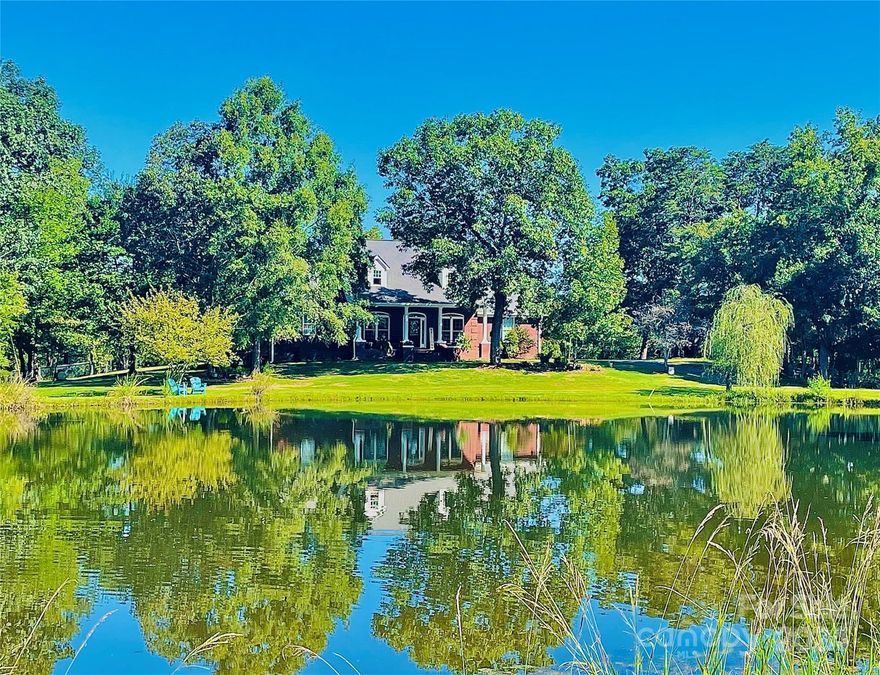 Retreat to this country getaway nestled on 24.4 acres of picturesque land. Enjoy the front porch view of your own pond, cornfield, and serene countryside. Step out onto the rear deck and take in the tranquil beauty of the creek flowing through the property.

A winding driveway around the pond sets the stage for a secluded and peaceful setting. Inside, you'll find a well-designed layout w/ 4 bedrooms, 3 1/2 baths, and a popular split bedroom plan offering privacy and comfort. The spacious great room with a cozy fireplace and gas logs is perfect for gathering with family and friends.

A private owners’ suite provides a relaxing retreat, while an office and an upstairs bonus room offer versatile spaces for work or leisure. Updates within the last 2 years ensure modern convenience and style throughout the home. A 3-car side entry garage provides ample space for vehicles and storage.

Don't miss the opportunity to make this alluring property your own private oasis in the countryside.