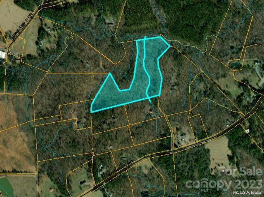 New Aerial Photos of great 14.47 acreage w/creek, great privacy, yet close to all! Amazing opportunity to build in desirable and gorgeous Green Creek area. Great opportunity! Wow! Wow! Wow!   This beautiful acreage features a creek, and is close to Tryon Equestrian Center. Build your dream home, or 2nd home getaway with 14.47 acres you have a lot of great choices. Located in the heart of the Desirable Green Creek area, this fantastic 14.47 acre parcel with privacy galore! This acreage features a creek, just need to clear area for pastures, some level spots for building and is close to Tryon International Equestrian Center. Build your year round dream home, 2nd home getaway, with 14.47 acres you have a lot of great choices. This land is not subdividable. Access is on the gravel Aster Lane off of McEntire Rd and the property is down beyond the two wooden signs saying not to block the road, keep going and For Sale sign is on the right, ask your agent for help viewing property!