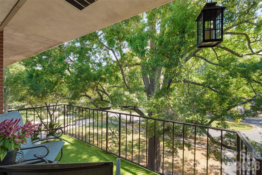 Back on market at no fault of sellers - buyers terminated 3 days before closing due to an emergency, this is your buyer's second chance! A rare opportunity to live above it all in one of Myers Park’s most desirable addresses. Originally designed as a true 3-bedroom, 2-bath residence, this top-floor, corner condo is now thoughtfully configured as a spacious 2 bedroom, 2-bath and can be easily reconverted to a true third bedroom—an incredible opportunity to add value and tailor the layout to your lifestyle. 

This top-floor corner condo, perched privately at the end of the building, lives like your own serene treehouse retreat with uninterrupted treetop views from every room and over 1300 sq ft of bright, open living space. Step into a welcoming great room with classic parquet floors, floor-to-ceiling sliding glass doors, and abundant natural light. A spacious office/den, complete with built-in desk and shelving, adds exceptional flexibility. 

The kitchen features custom cabinetry, a newer gas range and microwave, and a grandfathered-in washer and dryer—a rare advantage in this community. Ideal for hosting or unwinding, the home also boasts a generous balcony overlooking lush, mature greenery.

Life at Queens Tower provides you an all-inclusive HOA covering ALL utilities: Heat/AC, gas, electric, water, sewer, trash, pool, cable, building maintenance, landscaping, and reserves—allowing predictable monthly costs with exceptional convenience. Enjoy covered parking directly to your front door, plus ample guest parking.

Residents have access to a sparkling community pool, tree-lined sidewalks, and beautifully maintained grounds. Outside your door, you’re just moments from Freedom Park, Queens University, local shops, restaurants, the library, and a quick drive to South End and Uptown.

Similar units in the building—without the premium top-floor placement—have recently listed or sold between $483,000 and $539,000, offering a unique opportunity to step into significant built-in equity.

This private, light-filled home combines charm, convenience, versatility, and unmatched location. Come experience this exceptional Myers Park residence for yourself.